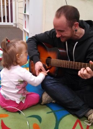 staff playing with child